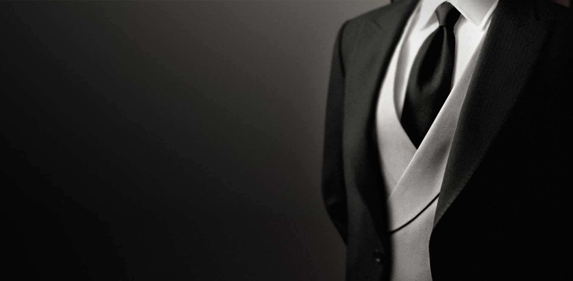 A person wearing a suit and tie