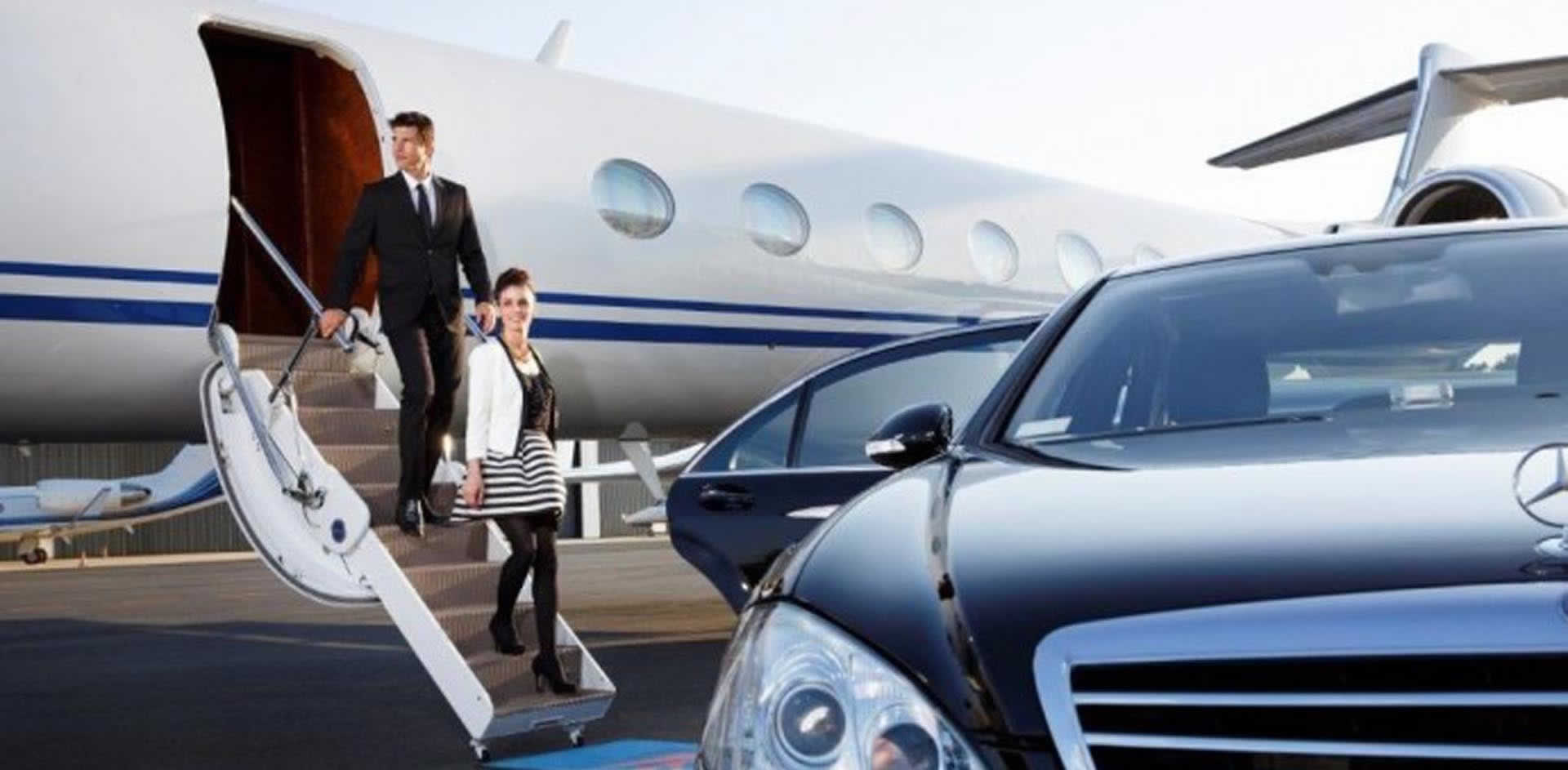 a chauffeur opening a car